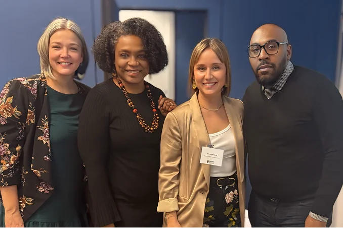 Group of business people standing next to each other.
